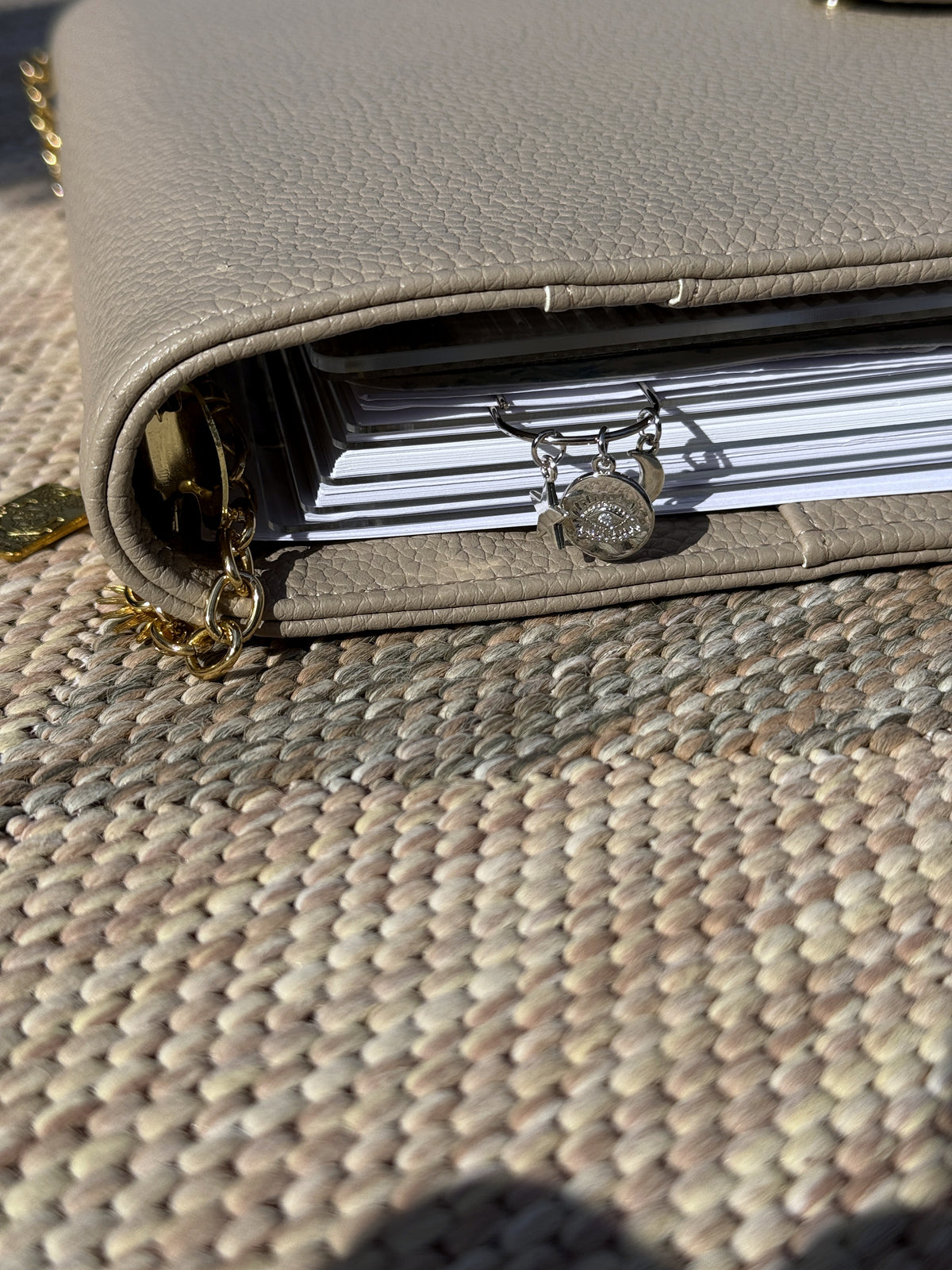 Evil Eye Coin Star & Moon Planner Clip clipped onto a planner page