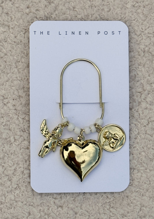 Cherub Heart & Coin Planner Clip in gold on a The Linen Post card