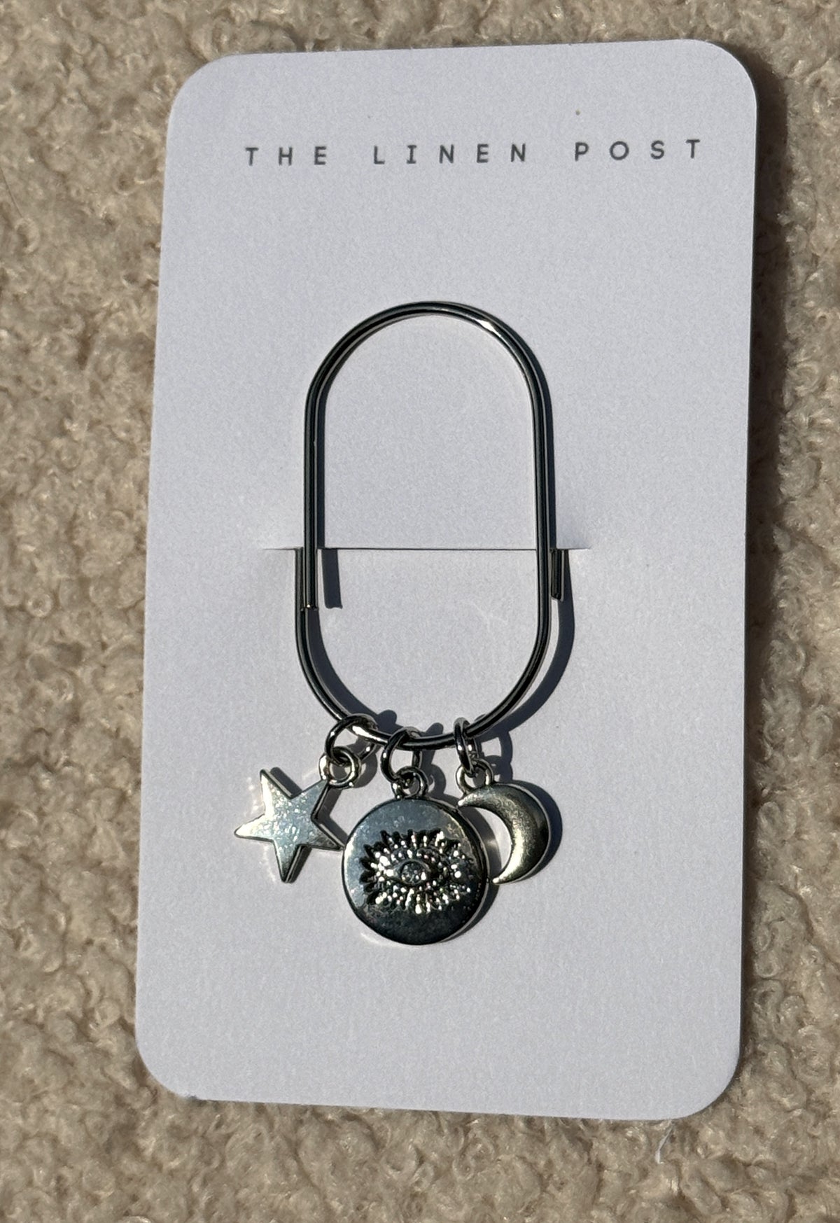 Evil Eye Coin Star & Moon Planner Clip in silver on a The Linen Post card