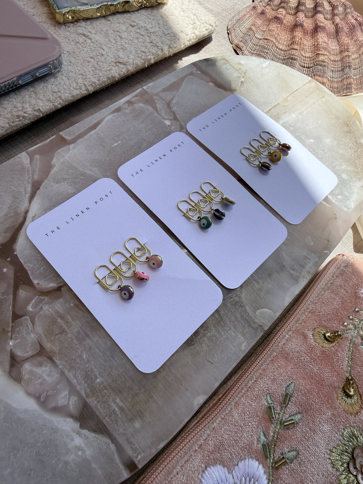 All three Mini Evil Eye Heart Clip Sets at an angle