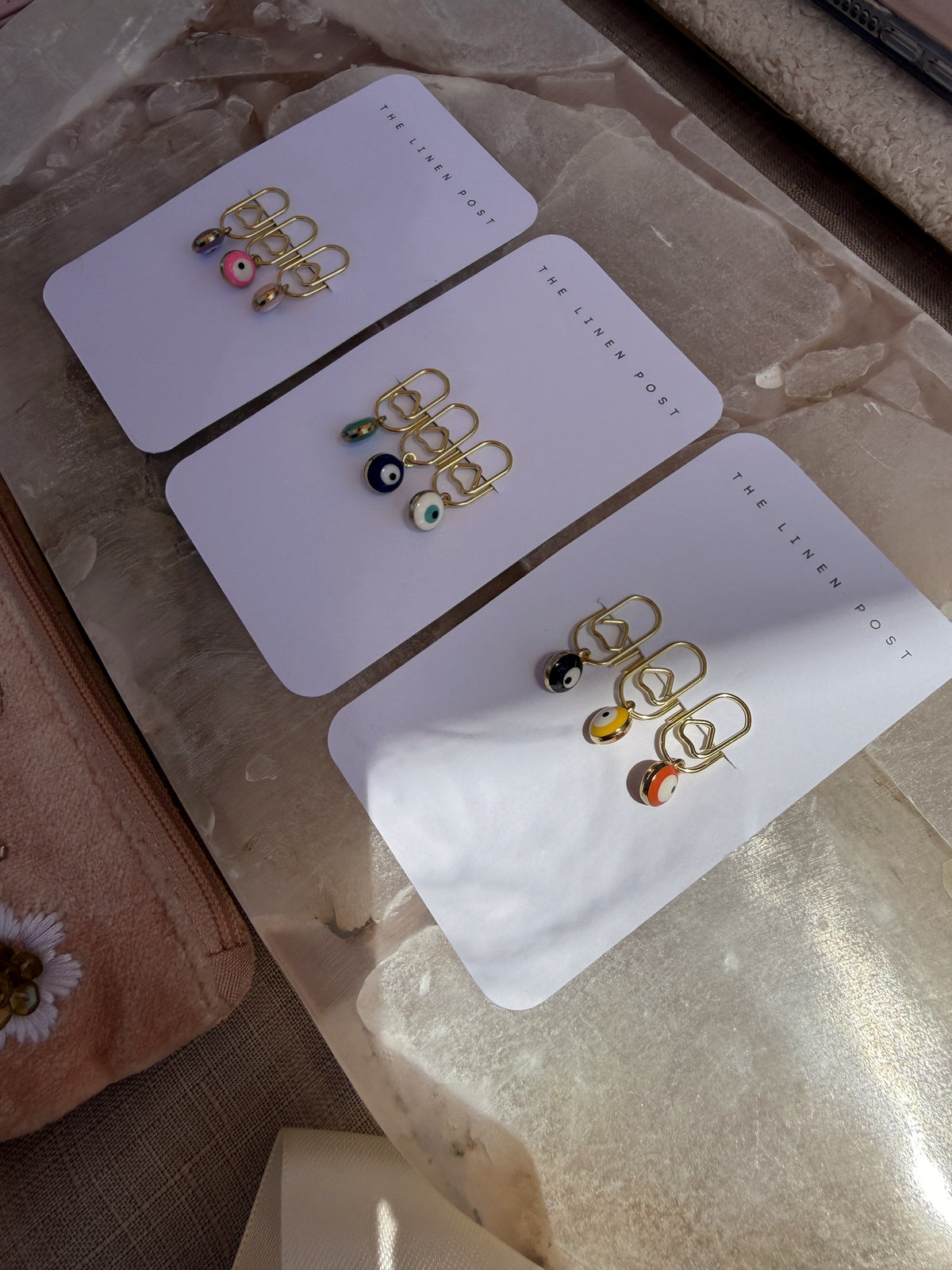 All three Mini Evil Eye Heart Clip Sets on their cards