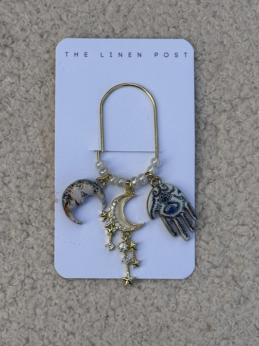 Moon Star & Hamsa Planner Clip in gold on a The Linen Post card