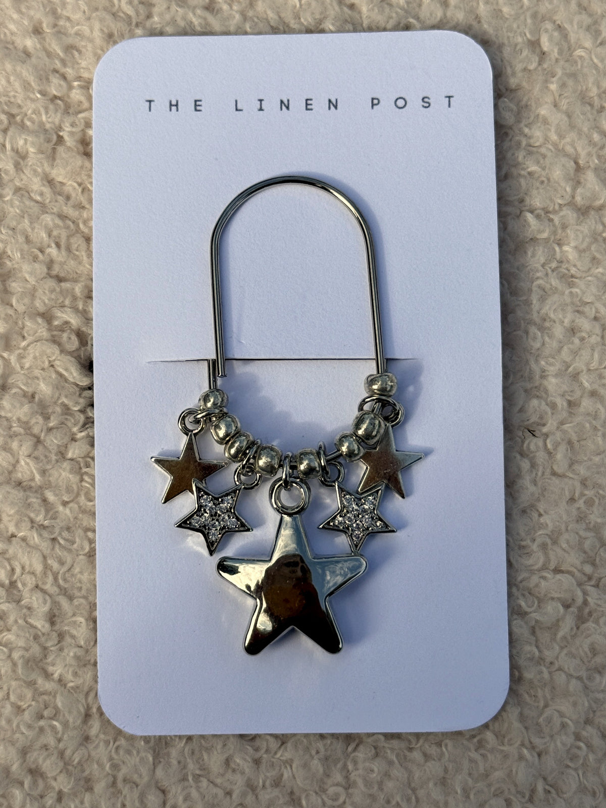 Puffy Star Planner Clip in silver on a The Linen Post card