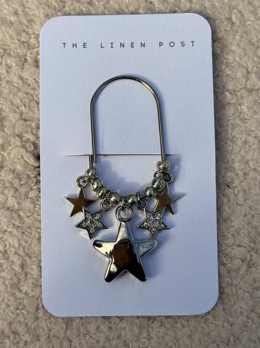 Puffy Star Planner Clip in silver on a The Linen Post card