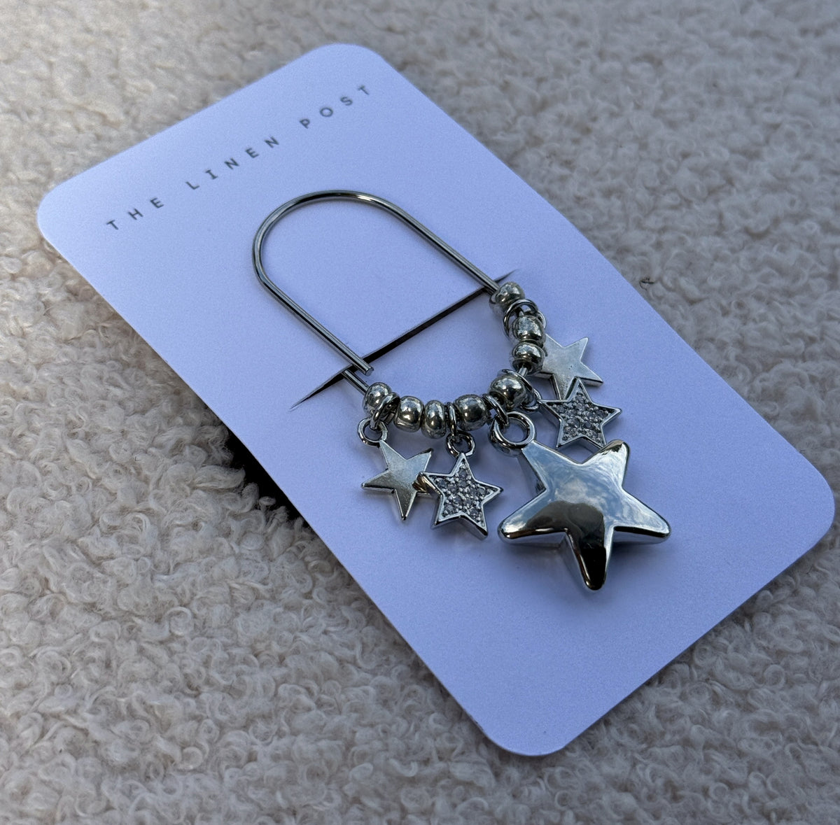 Puffy Star Planner Clip shown at an angle on its card