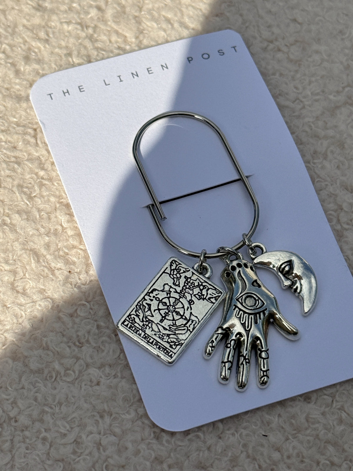 Tarot Hand & Moon Planner Clip at an angle on its card