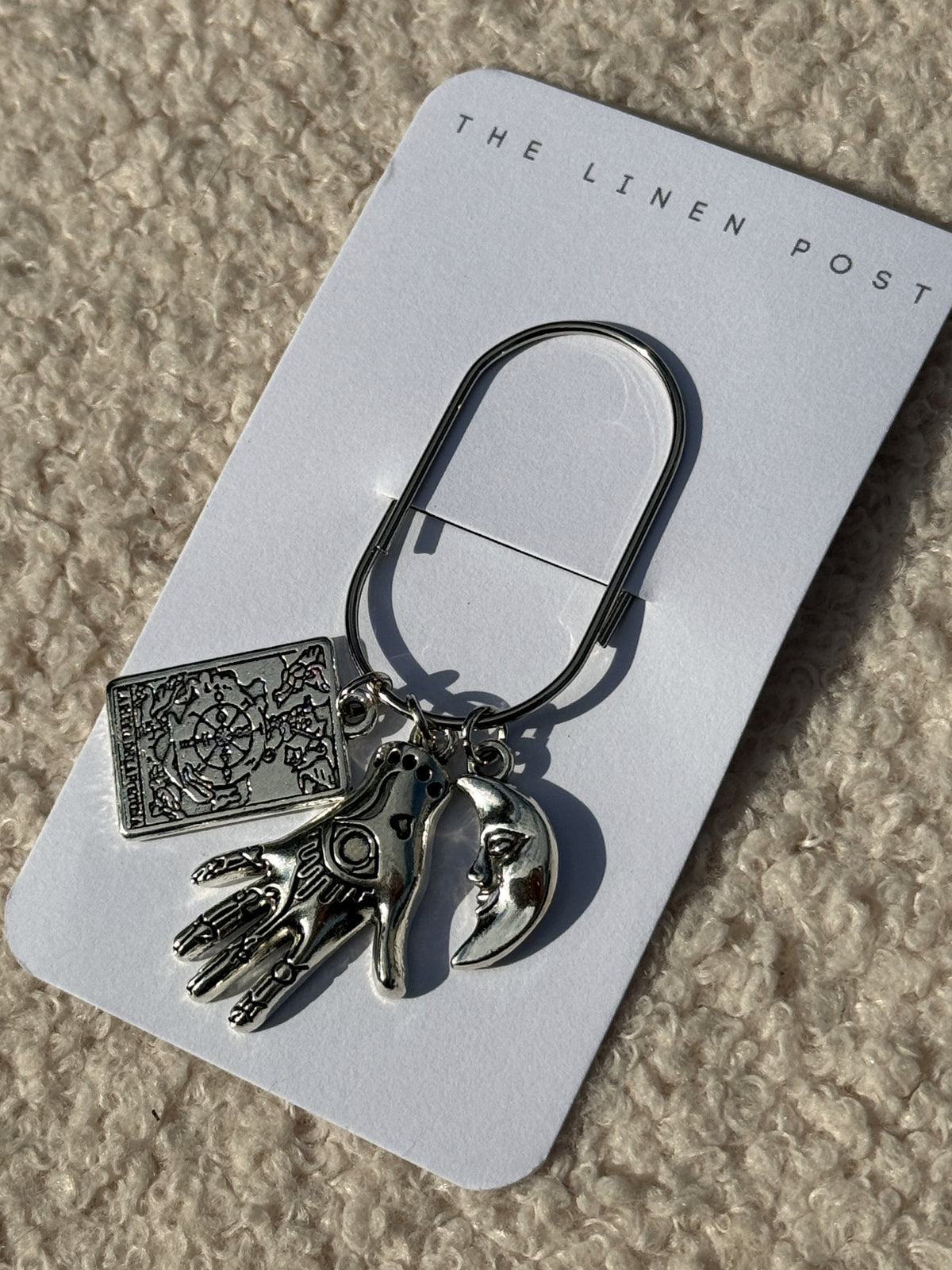 Tarot Hand & Moon Planner Clip shown on its card