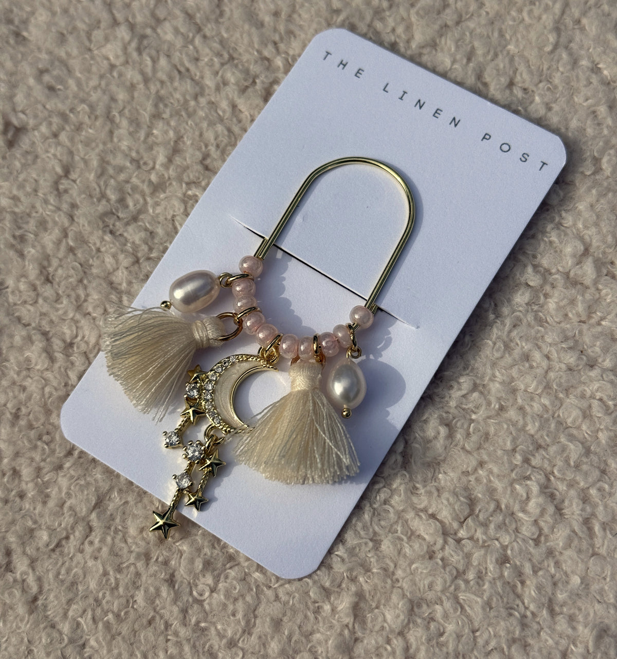Tassel Moon & Star Planner Clip shown at an angle on its card